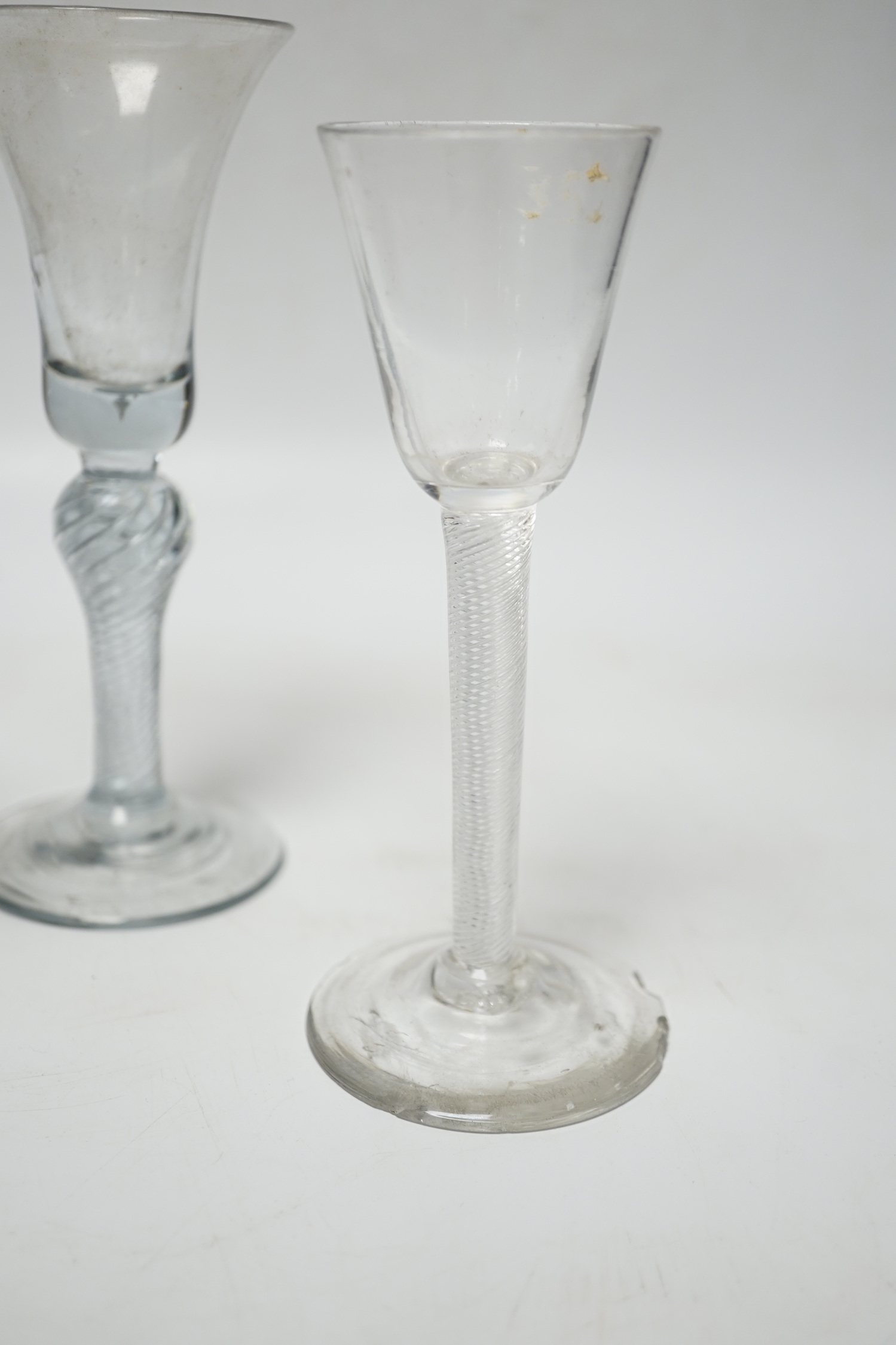 Three 18th century air twist stemmed wine glasses, tallest 16.5cm high